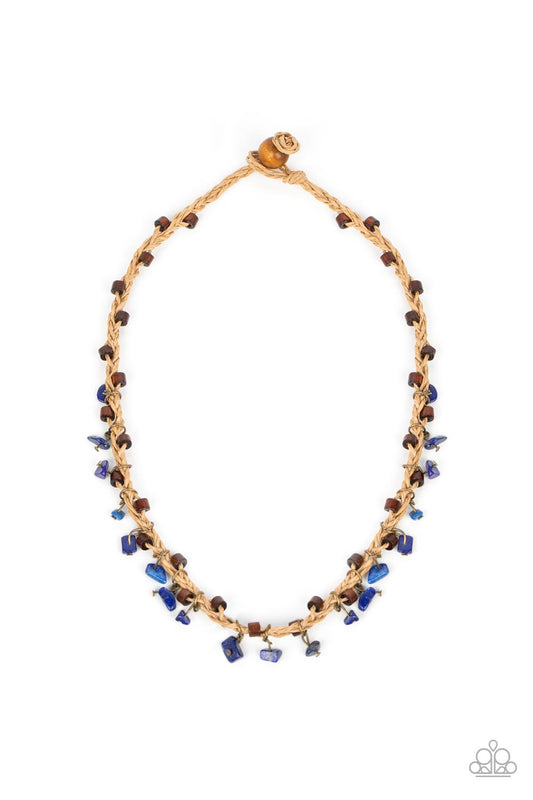 Infused with wooden accents, pieces of lapis lazuli swing from braided strands of crepe-like twine below the collar for a seasonal fringe. Features a button loop closure.  Sold as one individual necklace.