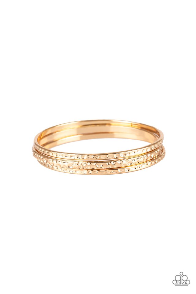 Delicately hammered in shimmery textures, a trio of glistening gold bangles glide across the wrist for a sleek look.  Sold as one set of three bracelets. 