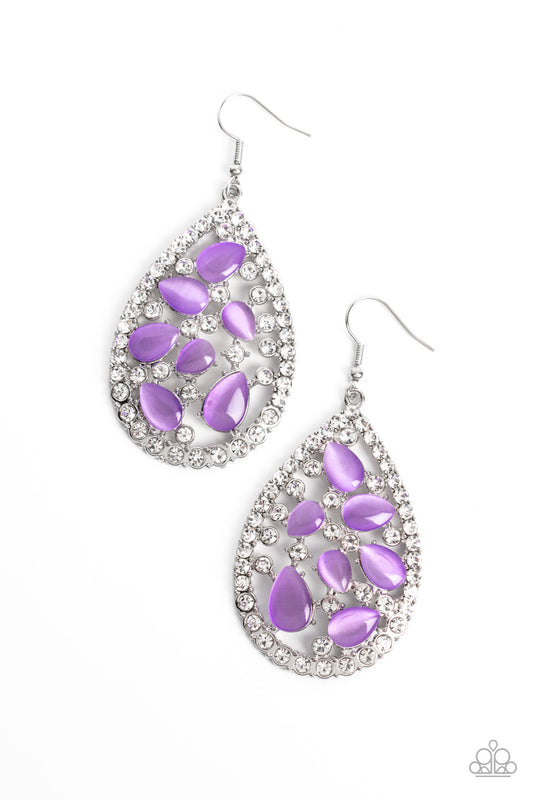 Sporadically clustered against an airy, teardrop backdrop, purple cat's eye stones shimmer and shine. An explosion of crystal white gems around the cat's eye stones and silver teardrop frame create additional light-catching sheen to the refined design. Earring attaches to a standard fishhook fitting.  Sold as one pair of earrings.