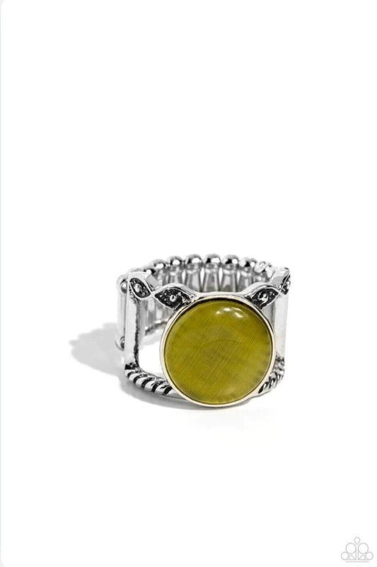 Encased in a sleek silver fitting, an oversized Olive Branch cat's eye sits atop two mismatched silver bands featuring studded and twisted texture for an ethereal pop of color atop the finger. Features a stretchy band for a flexible fit.  Sold as one individual ring.