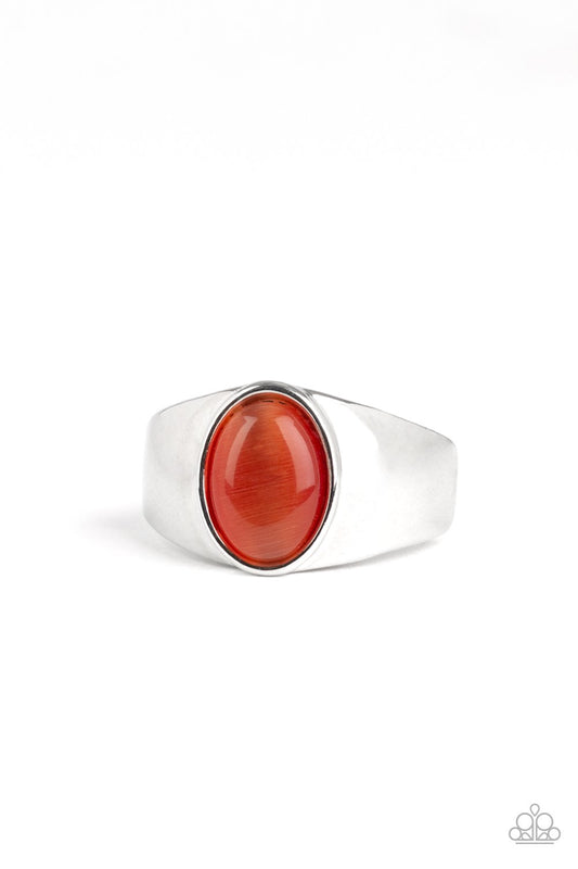 Chiseled into a tranquil oval, a glowing orange cat's eye stone is pressed into the center of a glistening silver band. Features a stretchy band for a flexible fit.  Sold as one individual ring.