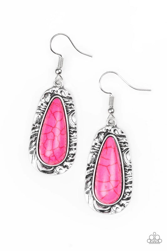 Chiseled into a tranquil teardrop, a vivacious pink stone is pressed into the center of a shimmery silver frame radiating with hammered details for an artisan inspired look. Earring attaches to a standard fishhook fitting.  Sold as one pair of earrings.
