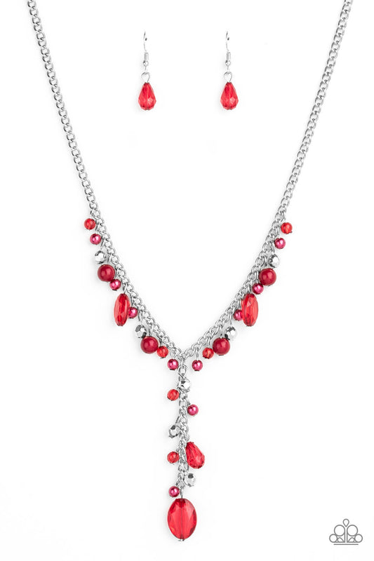 Mismatched polished red beads, crystal-like beads, and faceted silver beads dance along a shimmery silver chain. Matching beading trickles along a single silver chain, creating a romantic extended pendant below the collar. Features an adjustable clasp closure.  Sold as one individual necklace. Includes one pair of matching earrings.