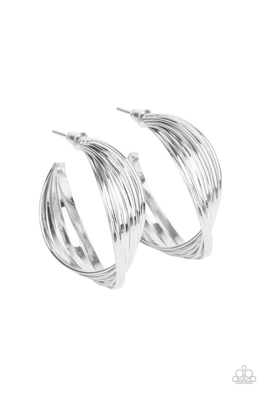 A stack of shiny silver hoops delicately twists at the center, creating a curvaceous display. Earring attaches to a standard post fitting. Hoop measures approximately 1 1/4" in diameter.  Sold as one pair of hoop earrings.