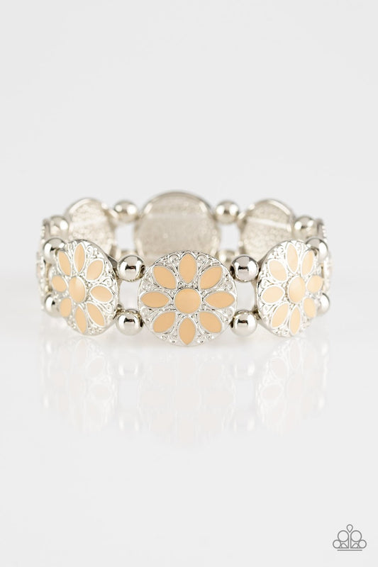 Painted in a neutral brown finish, ornate silver floral frames are threaded along a stretchy band across the wrist for a seasonal look.  Sold as one individual bracelet.