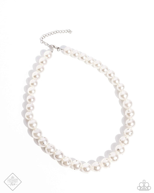 Infused along an invisible string, a collection of glossy white pearls, gradually dusted in dainty white rhinestones as it cascades towards the center of the neckline creates a radiantly, refined display. Features an adjustable clasp closure.  Sold as one individual necklace. Includes one pair of matching earrings.