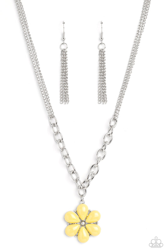 Primrose acrylic petals bloom from and around silver-studded accents and a studded center. The colorful display hangs from a collection of thick silver oval links that interlock and hang below a double-layered silver chain for a bright, floral finish.  Sold as one individual necklace. Includes one pair of silver fringe earrings.