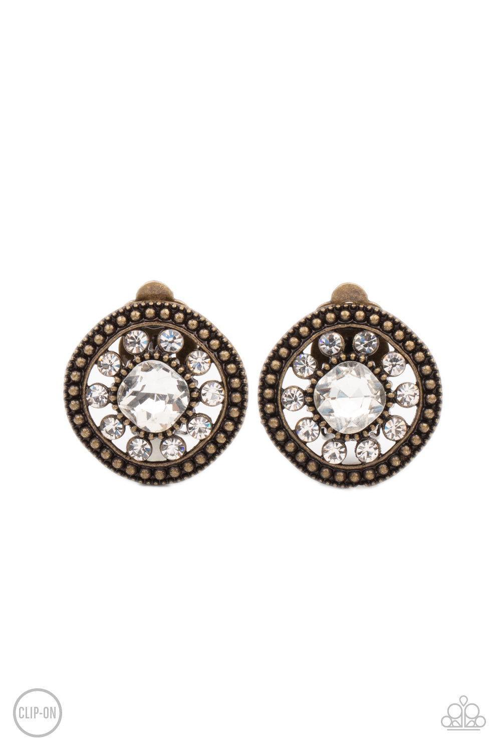 Featuring an oversized center, a white rhinestone encrusted flower blooms across the brass center of a studded frame for a sparkly finish. Earring attaches to a standard clip-on fitting.  Sold as one pair of clip-on earrings.