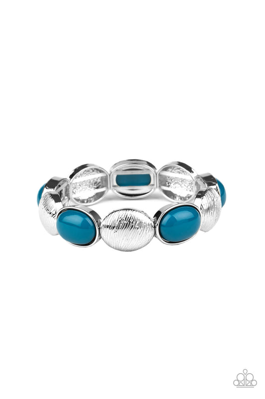 Bubbly blue beaded frames and textured silver caps alternate along stretchy bands around the wrist, adding a colorful pop of color.

Sold as one individual bracelet.