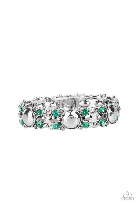 Green teardrop and round and marquise cut hematite rhinestones flare out from a faceted silver beaded center, coalescing into glitzy frames. The gorgeous frames are threaded along stretchy bands around the wrist, resulting in a sassy centerpiece.  Sold as one individual bracelet.