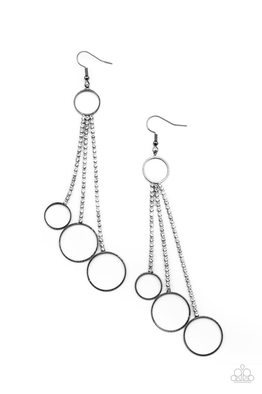 Dainty gunmetal hoops swing from the bottom of glittery strands of glassy white rhinestones that attach to the bottom of a dainty gunmetal ring, creating a tantalizing tassel. Earring attaches to a standard fishhook fitting.  Sold as one pair of earrings.