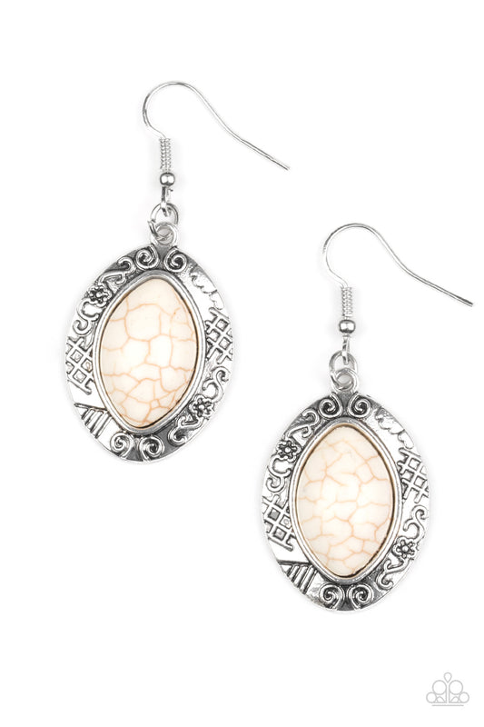 A refreshing white stone is pressed into the center of a glistening silver frame radiating with floral and tribal inspired patterns for a seasonal look. Earring attaches to a standard fishhook fitting.  Sold as one pair of earrings.