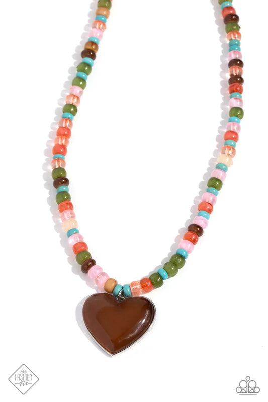 tretched across an invisible wire, multicolored beads, featuring various opacities and sheens, coalesce around the collar. An oversized brown cat's eye stone in a silver heart frame swings from the bottom of the multicolored display, creating an earthily endearing pendant. Features an adjustable clasp closure.  Sold as one individual necklace. Includes one pair of matching earrings.