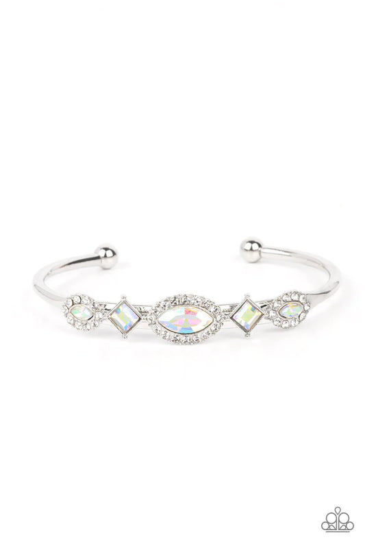 Bordered in glassy white rhinestones, a dainty arrangement of marquise cut rhinestones alternates with tilted square cut rhinestones across the front of a dainty silver cuff for a surprisingly sparkly finish.  Sold as one individual bracelet.
