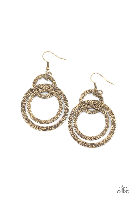 Etched and embossed in shimmery textures, a trio of antiqued brass hoops interlock into a dizzying lure. Earring attaches to a standard fishhook fitting.  Sold as one pair of earrings.