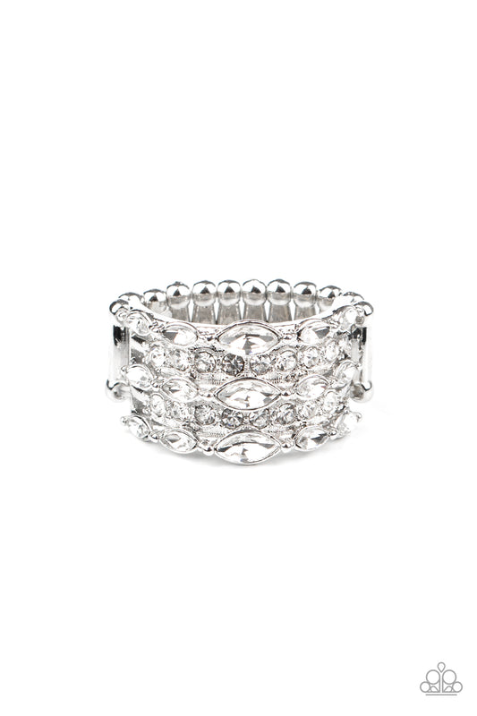 Featuring mismatched cuts, uneven rows of glittery white rhinestones stack across the finger, coalescing into a dazzling frame. Features a dainty stretchy band for a flexible fit.  Sold as one individual ring.