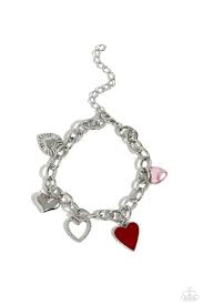 A textured silver heart silhouette, sleek silver heart, sunburst-detailed silver heart, red-painted heart, and baby pink pearl heart dangle along a silver chain for a romantic declaration. Features an adjustable clasp closure around the wrist.

Sold as one individual bracelet.