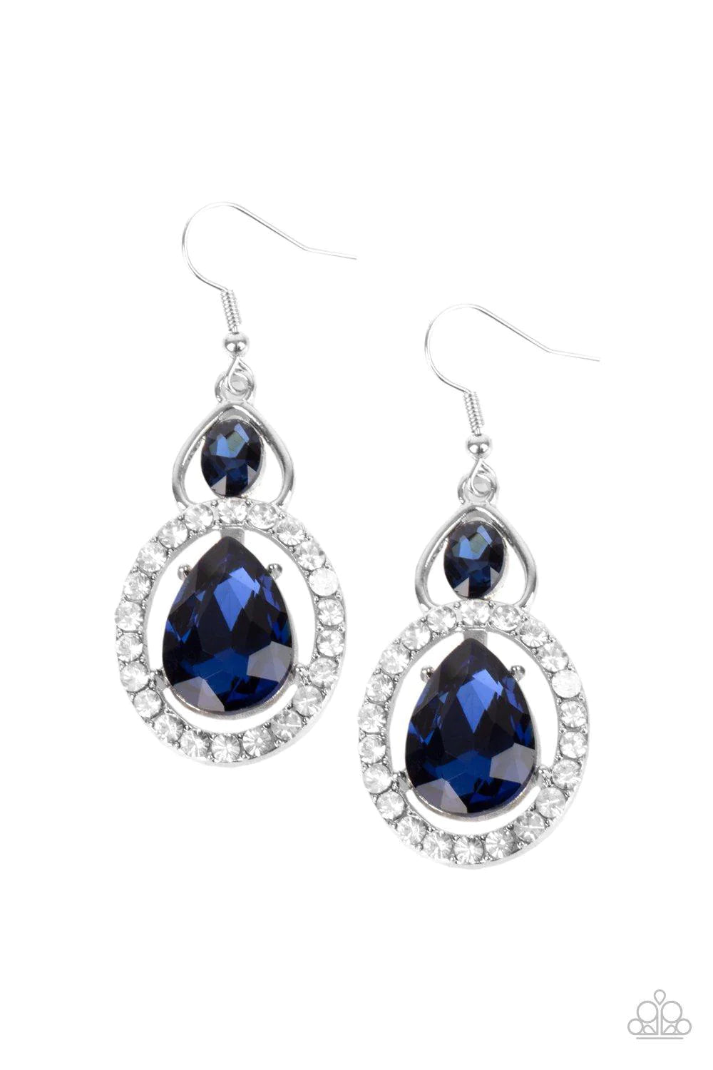 An oversized blue teardrop gem is nestled inside a ring of glassy white rhinestones that attaches to an airy silver fitting adorned with a blue oval rhinestone. Earring attaches to a standard fishhook fitting.  Sold as one pair of earrings.