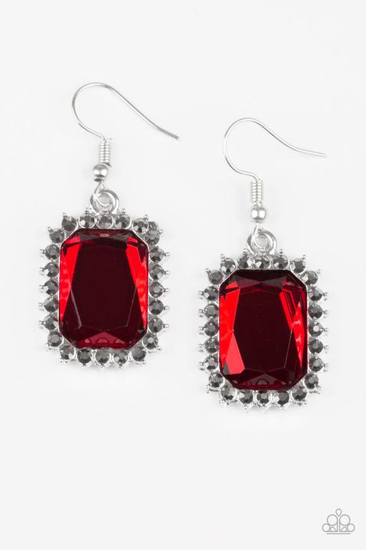 Featuring a regal emerald-style cut, a fiery red gem is pressed into a sleek silver frame radiating with dainty hematite rhinestones. Earring attaches to a standard fishhook fitting.  Sold as one pair of earrings.