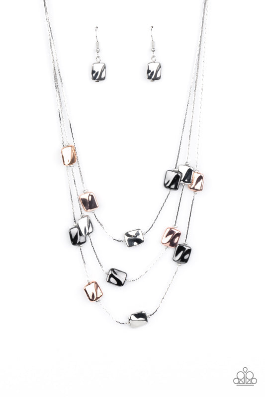 Featuring a decorative surface, dainty rose gold, gunmetal, and silver rectangular accents are fitted in place along three sleek silver chains, creating refined layers below the collar. Features an adjustable clasp closure.  Sold as one individual necklace. Includes one pair of matching earrings.