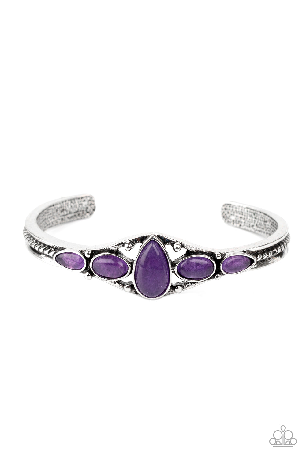 A vivacious collection of purple stones are encrusted across the front of a dainty silver cuff for a seasonal flair.  Sold as one individual bracelet.