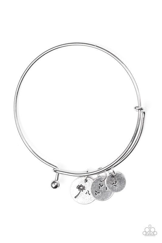 Stamped in dandelion patterns, glistening silver charms featuring floral patterns slide along a sleek bar fitting for a whimsical look. Features a toggle closure.  Sold as one individual bracelet.
