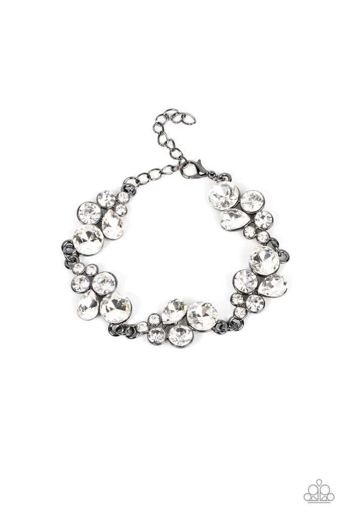 Featuring sleek gunmetal frames, clusters of round and teardrop white rhinestones delicately link around the wrist for a dash of effervescent elegance. Features an adjustable clasp closure.  Sold as one individual bracelet.