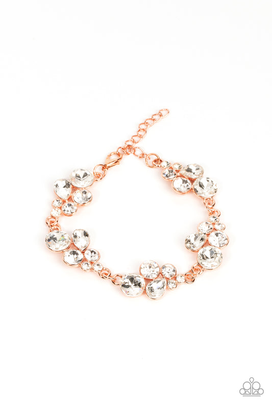 Featuring shiny copper frames, clusters of round and teardrop white rhinestones delicately link around the wrist for a dash of effervescent elegance. Features an adjustable clasp closure.  Sold as one individual bracelet.