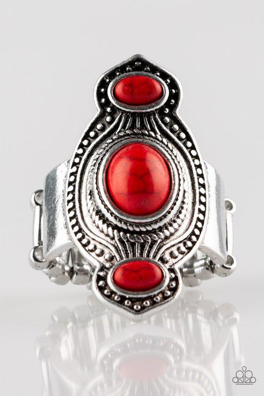 Three fiery red stones are pressed into an abstract silver frame radiating with texture and studded details for a seasonal look. Features a stretchy band for a flexible fit.  Sold as one individual ring.