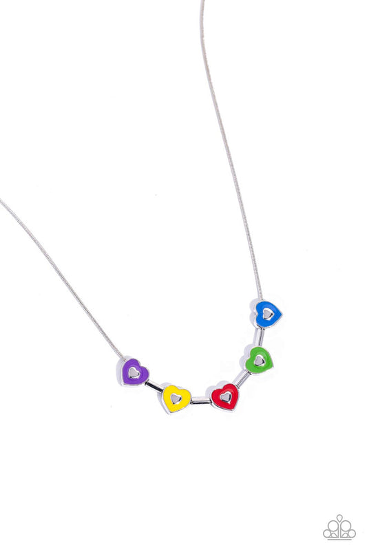 Strung along a dainty silver chain, a collection of silver heart frames, and silver bars alternate for a dainty display around the collar. Each heart is painted in a French Blue, Classic Green, red, High Visibility, and purple hue with dainty silver hearts glistening at their centers for a pop of colorful detail. Features an adjustable clasp closure.  Sold as one individual necklace. Includes one pair of matching earrings.