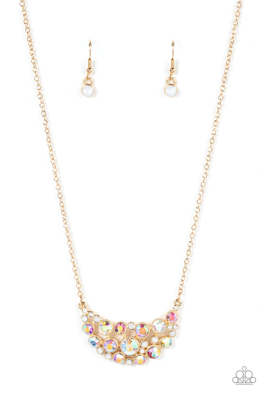 An effervescent collection of opal and iridescent rhinestones delicately join into a bubbly half moon pendant at the bottom of a dainty gold chain, resulting in a sparkly statement piece below the collar. Features an adjustable clasp closure.  Sold as one individual necklace. Includes one pair of matching earrings.