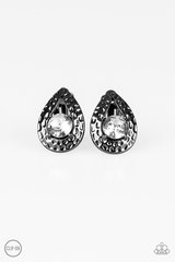 An oversized white rhinestone is nestled inside a hammered gunmetal teardrop, creating a regal frame. Earring attaches to a standard clip-on fitting.  Sold as one pair of clip-on earrings.