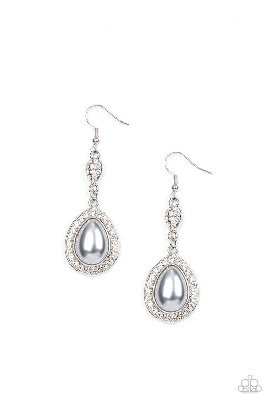 Bordered in glassy white rhinestones, an oversized pearly silver teardrop bead swings from the bottom of a dainty silver teardrop that is encrusted in glassy white rhinestones, resulting in a radiant lure. Earring attaches to a standard fishhook fitting.  Sold as one pair of earrings.