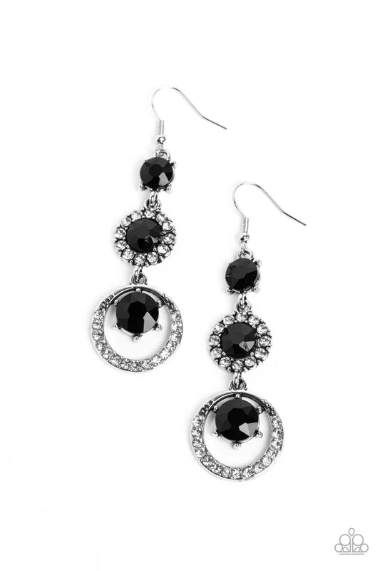 A glamorous collection of brilliant, round, jet black gems drip down the ear, creating an irresistibly refined lure. The topmost gem features pronged fittings, followed by the center gem that is bordered by a halo of dainty white rhinestones for additional eye-catching shimmer. Encircling the lower-most gem, an airy, rhinestone-encrusted hoop completes the dazzling design. Earring attaches to a standard fishhook fitting.  Sold as one pair of earrings.