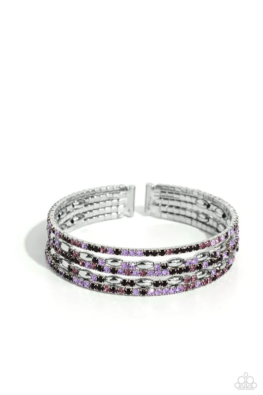 Four strands of dazzling white, light amethyst, lavender, and purple rhinestones flank shiny silver accents, coalescing into a sparkly layered cuff around the wrist.  Sold as one individual bracelet