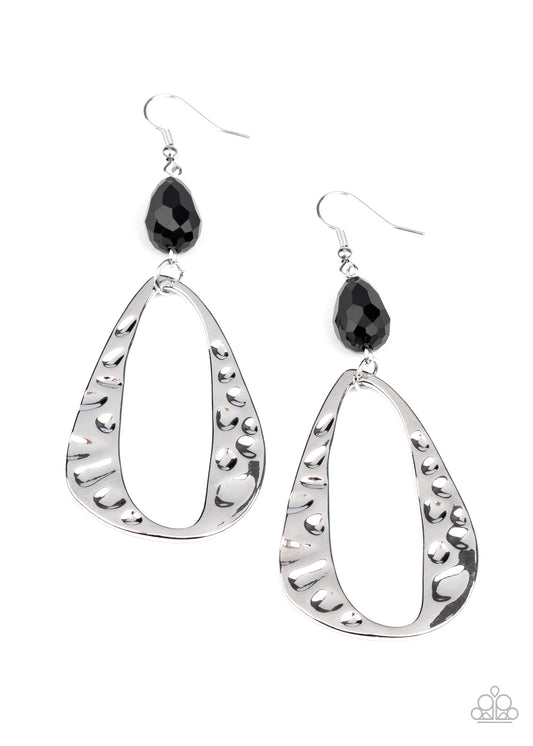 Hammered in shimmery detail, an imperfect silver teardrop swings from the bottom of a black crystal-like teardrop bead for a refined flair. Earring attaches to a standard fishhook fitting.  Sold as one pair of earrings.