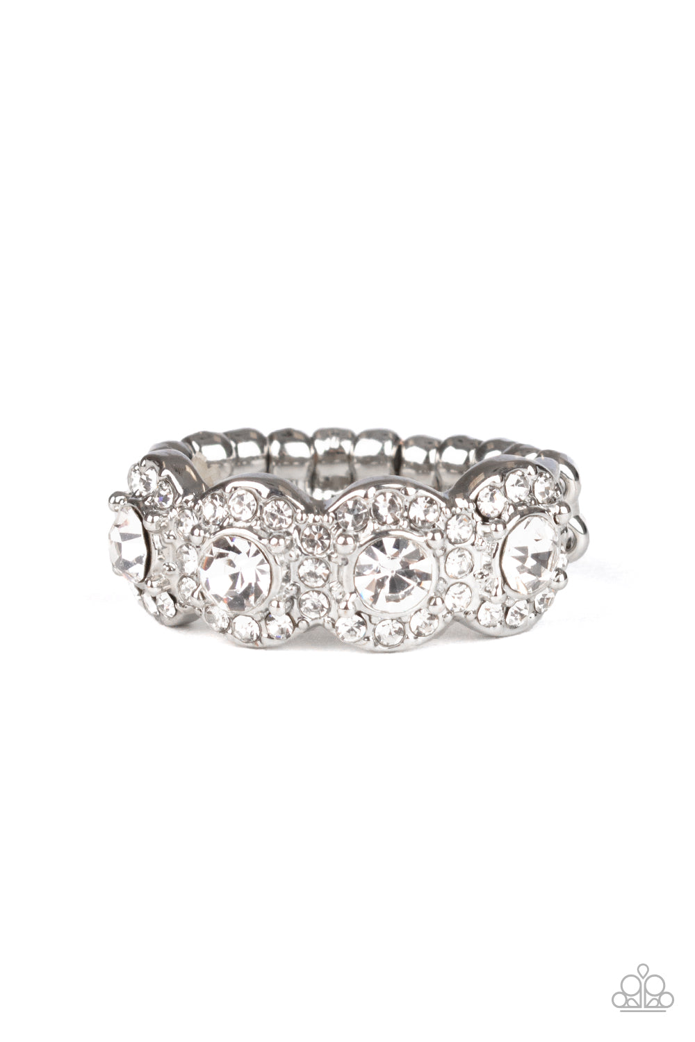 Bordered in rings of dainty white rhinestones, four classic white rhinestones are encrusted along the front of a dainty silver band for a timeless shimmer. Features a dainty stretchy band for a flexible fit.  Sold as one individual ring.