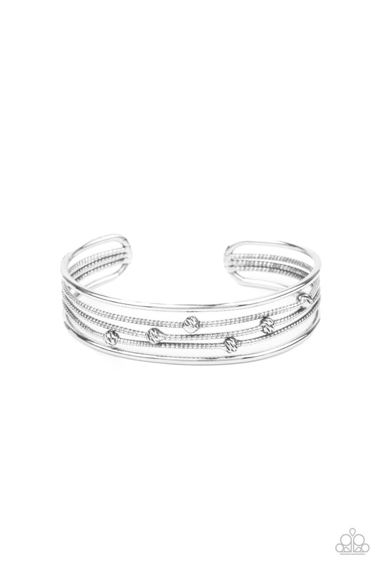 Dotted in ornate silver beads, textured silver wires layer between two smooth silver bars, stacking into an edgy cuff around the wrist.  Sold as one individual bracelet.