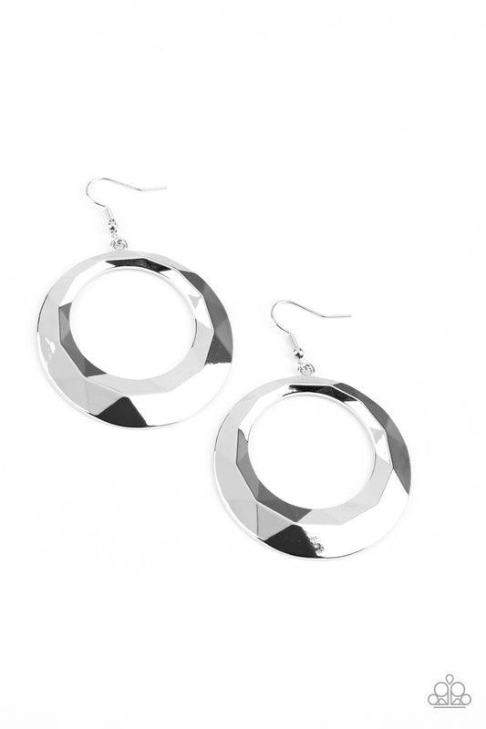 Faceted in light-reflecting textures, a beveled silver hoop swings from the ear for an edgy shine. Earring attaches to a standard fishhook fitting.  Sold as one pair of earrings.