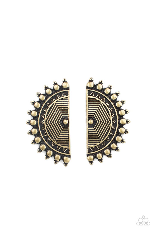 Tipped with triangular accents, flat brass studs fan out from the edge of a half moon frame embossed in antiqued linear texture, creating a bold tribal inspired display. Earring attaches to a standard post fitting.  Sold as one pair of post earrings.