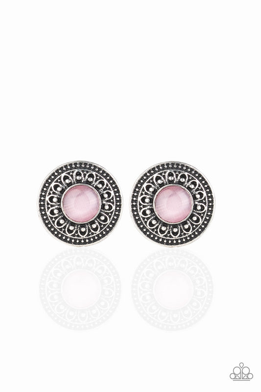 A glowing pink cat's eye stone is pressed into the center of a round silver frame embossed in blooming floral details for a seasonal vibe. Earring attaches to a standard post fitting.  Sold as one pair of post earrings.