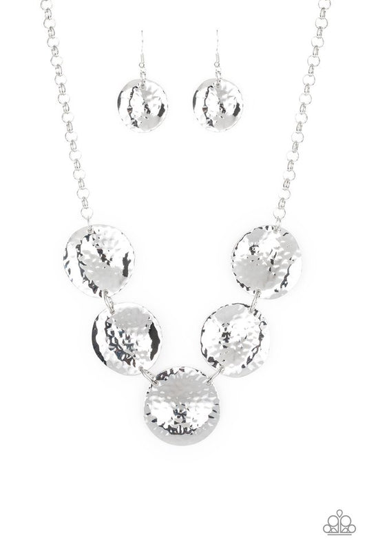 Featuring a hammered high-sheen finish, imperfect round silver frames link below the collar for a casual look. Features an adjustable clasp closure.  Sold as one individual necklace. Includes one pair of matching earrings.