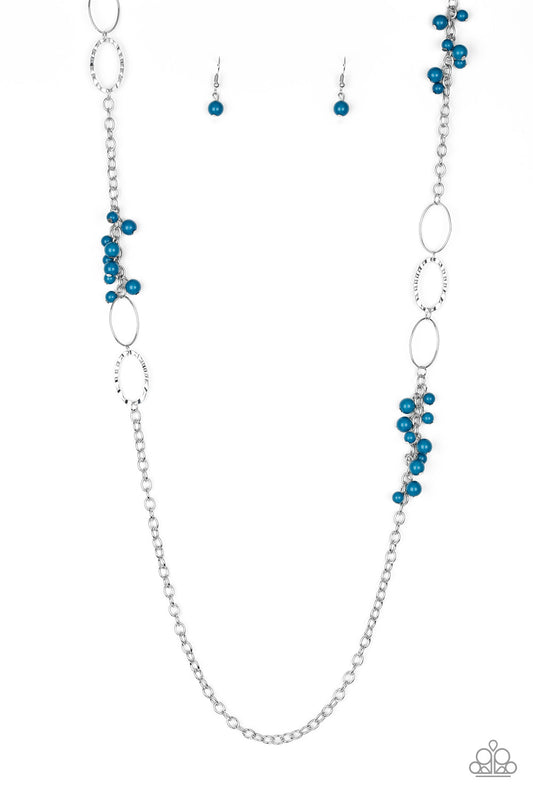 Smooth and hammered silver rings join clusters of refreshing blue beads along a shimmery silver chain for a colorful look. Features an adjustable clasp closure.  Sold as one individual necklace. Includes one pair of matching earrings.