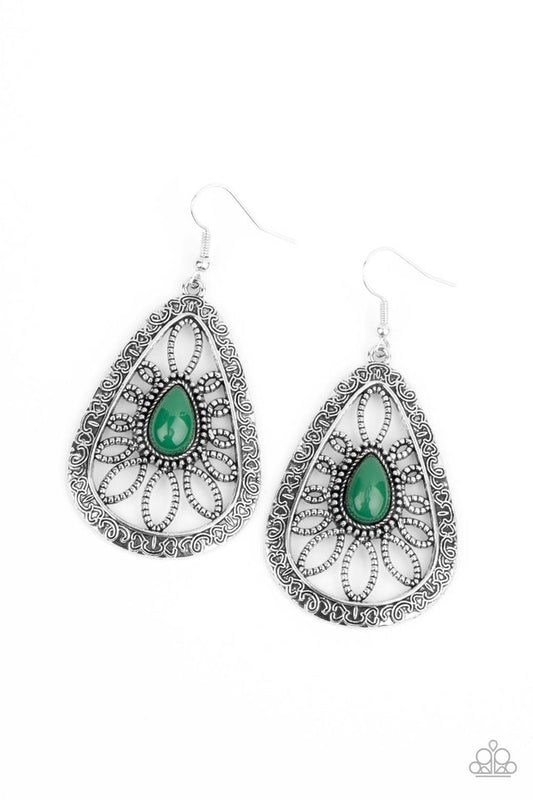 An Ultramarine Green bead is pressed into the center of an oversized ornate silver teardrop frame studded and embossed in swirling filigree detail for a whimsical look. Earring attaches to a standard fishhook fitting.  Sold as one pair of earrings.