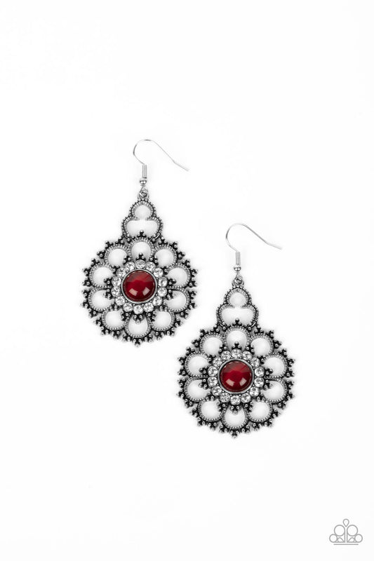 Bordered in a glassy ring of white rhinestones, a red cat's eye stone is pressed into the center of a studded silver floral frame for a mystical floral fashion. Earring attaches to a standard fishhook fitting.  Sold as one pair of earrings.