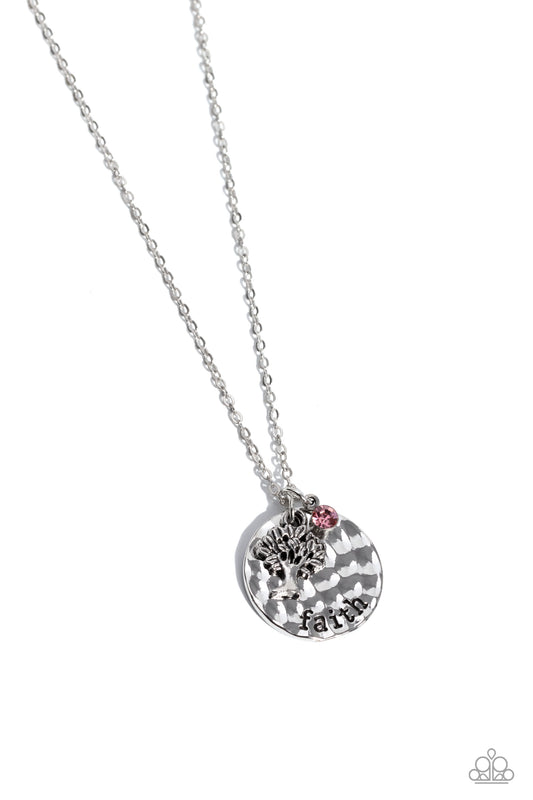 Hanging down the neckline, a silver disc, hammered in a high-sheen finish features the stamped word "faith". Gliding from a dainty silver chain, a detailed tree charm and a dainty pink rhinestone pressed into a silver frame finish the design with a sparkly flourish. Features an adjustable clasp closure.  Sold as one individual necklace. Includes one pair of matching earrings.