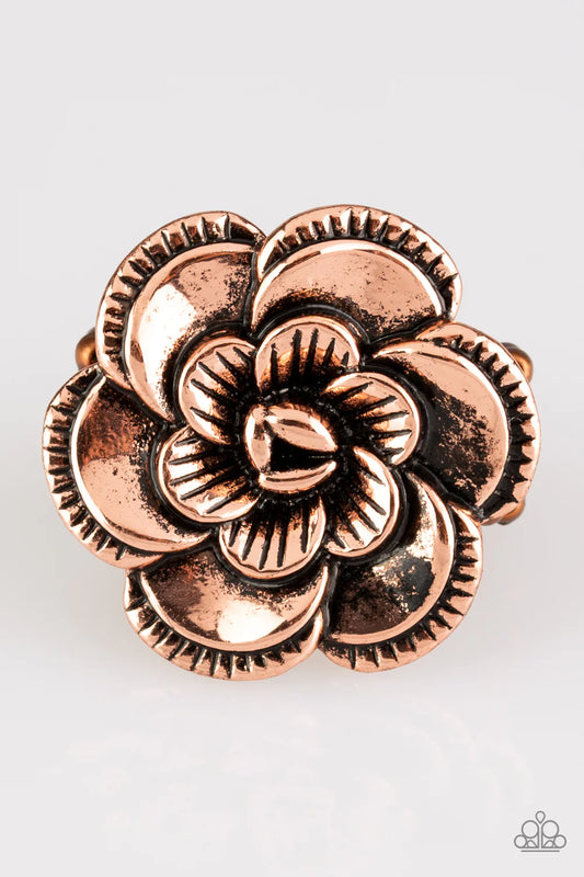Rippling in ornate detail, folds of copper petals bloom atop the finger for a seasonal look. Features a stretchy band for a flexible fit.  Sold as one individual ring.