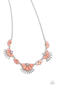 Three milky Desert Flower teardrops, set in dainty pronged fittings, alternate with solitaire white rhinestones that give way to a cluster of larger milky Desert Flower teardrops. Sleek silver bars flare out from the exaggerated teardrop display creating a fan-like arrangement along the neckline for a sense of refinement. Features an adjustable clasp closure.  Sold as one individual necklace. Includes one pair of matching earrings.