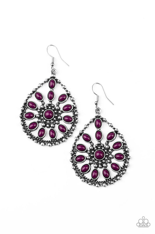 Shiny purple beads collect into a floral pattern inside of a studded silver teardrop, creating a whimsical frame. Earring attaches to a standard fishhook fitting.

Sold as one pair of earrings.