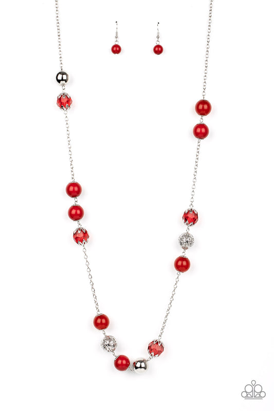 Infused with shiny silver beads and silver ornaments, a collection of glassy, polished, and crystal-like red beads drape across the chest for a colorful collision. Features an adjustable clasp closure.  Sold as one individual necklace. Includes one pair of matching earrings.